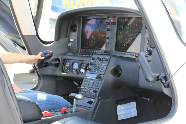 The glass cockpit of a Cirrus SR22, with two large primary displays and a keypad controller.